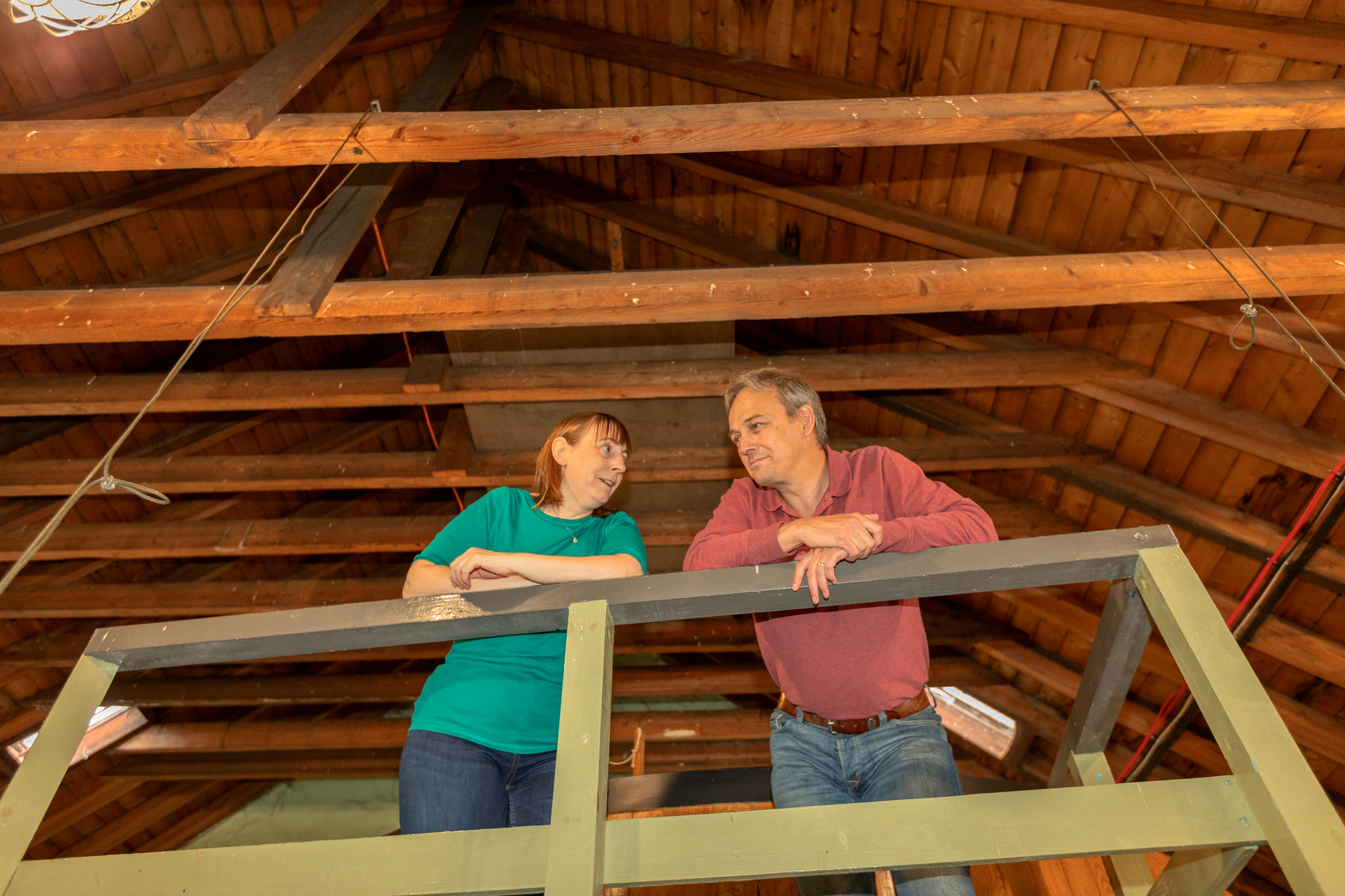 Visitors stand on an elevated platform inside Dallas Dhu distillery.