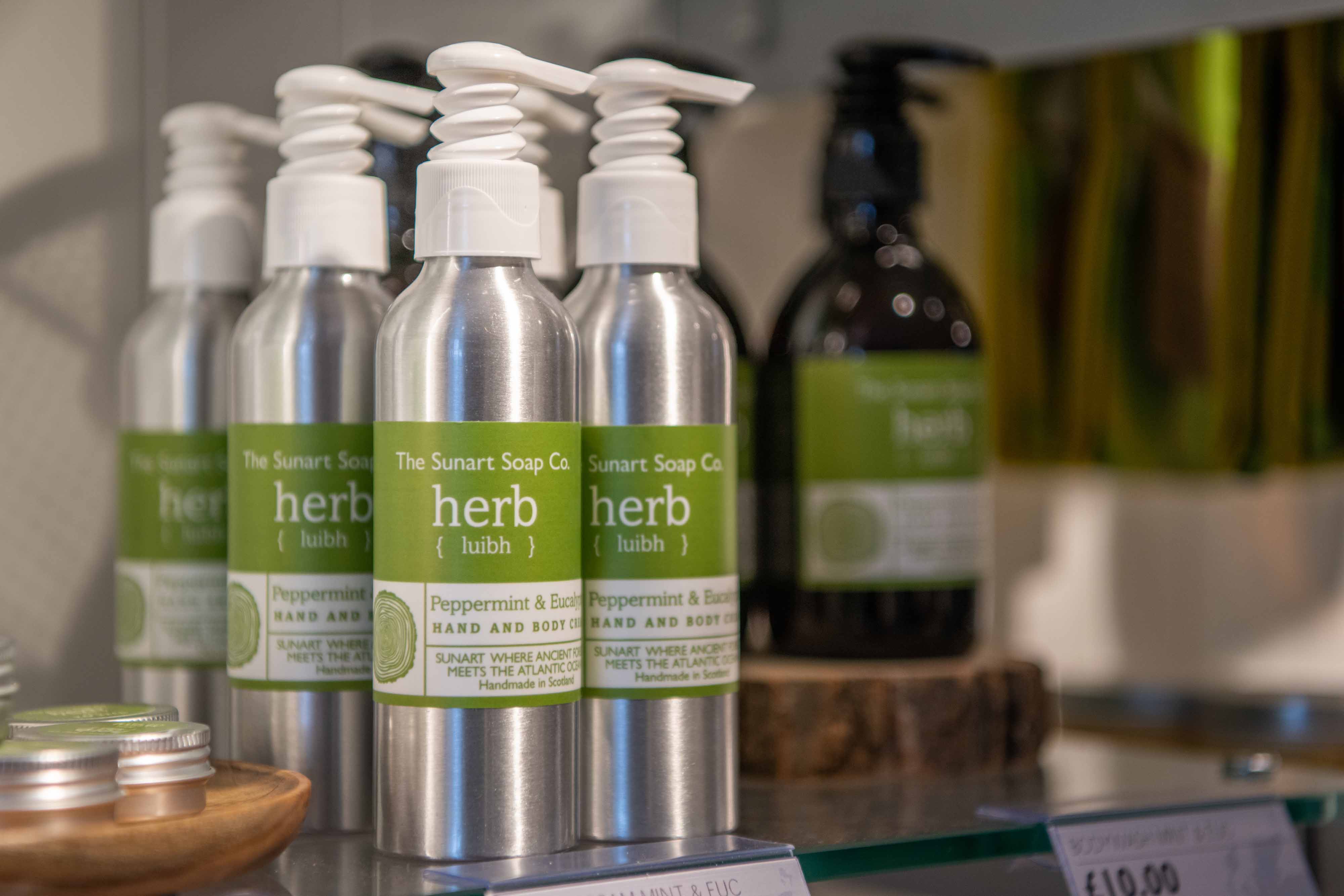 Shelves stocked with pumps of herbal hand soap