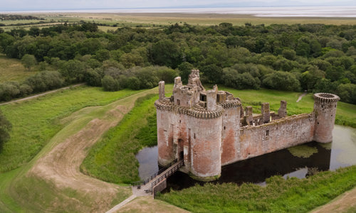 Aerial view of Caerlaverock and the wide moat surrounding it