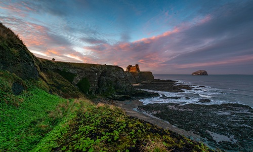 Tantallon Castle in the pinky sunset