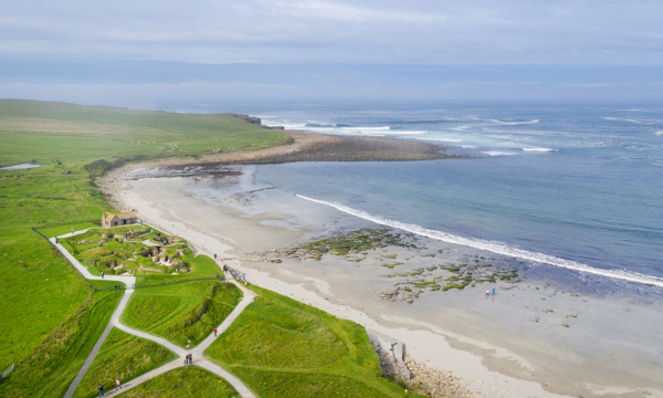 An aerial photo of Skara Brae - a historic settlement by the sea
