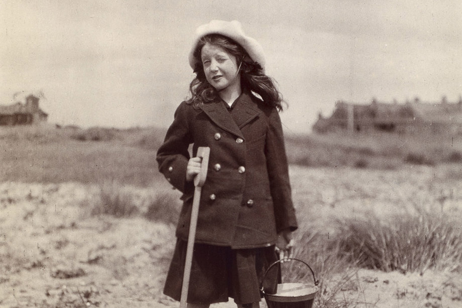 Photograph of girl on a beach. PHOTOGRAPH ALBUM NO 93 : THE STRANG COLLECTION, "SUNSHINE AND SHADE"