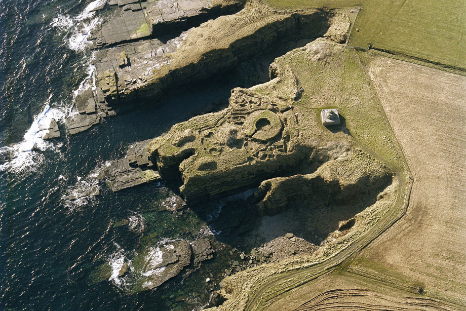 Oblique aerial view of the commemorative monument and the remains of Nybster broch, taken from the N