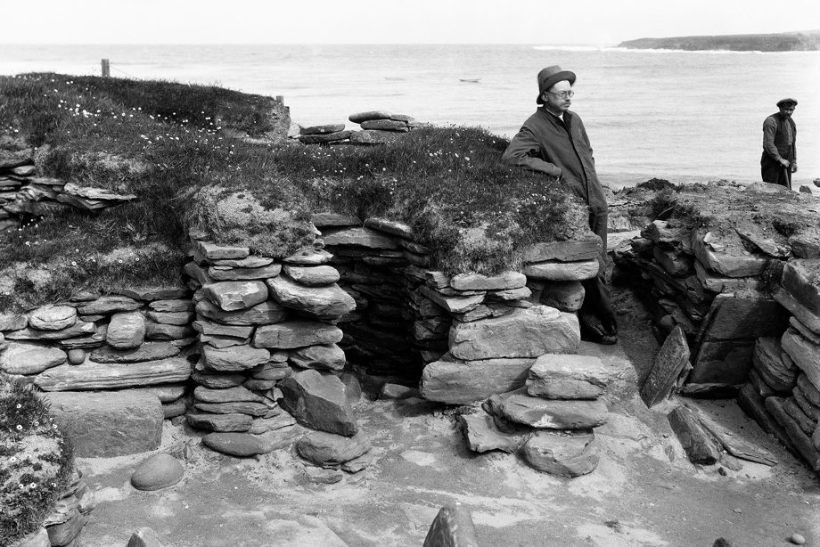 Excavation photograph showing Vere Gordon Childe at Hut 4 Door and cell 2, Skara Brae in 1930
