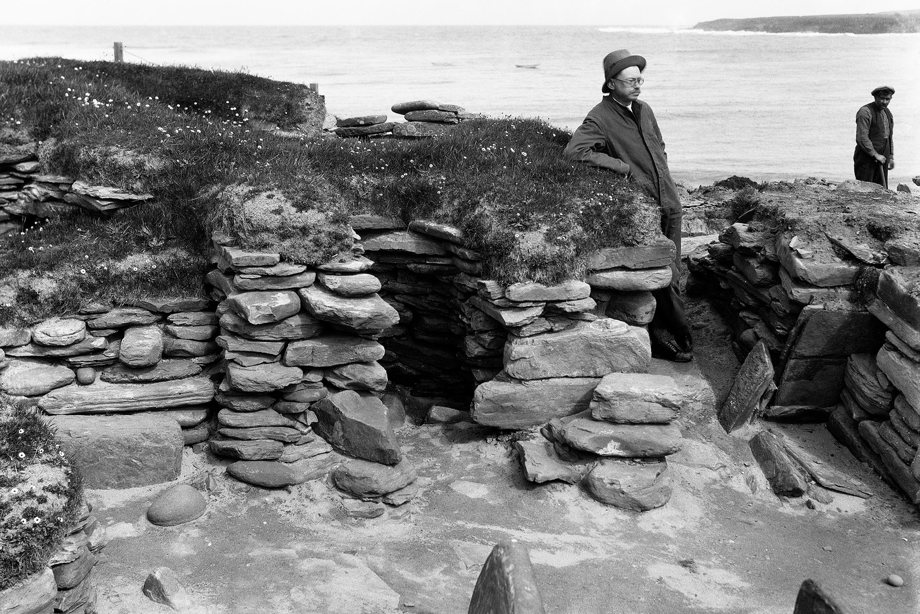 Excavation photograph showing Vere Gordon Childe at Hut 4 Door and cell 2, Skara Brae in 1930