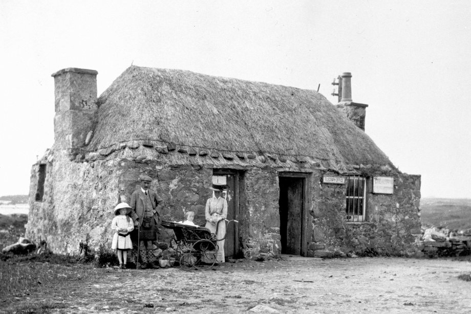 View of telegraph office at Creagorry, Benbecula, with family