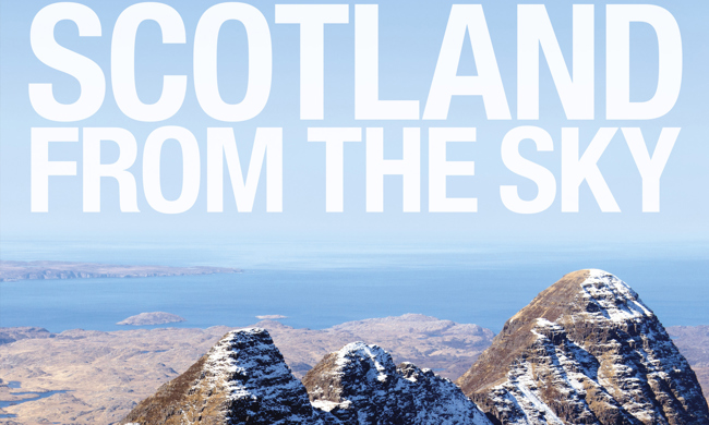 A cover of a book reading "Scotland from the Sky" showing snow capped mountains.