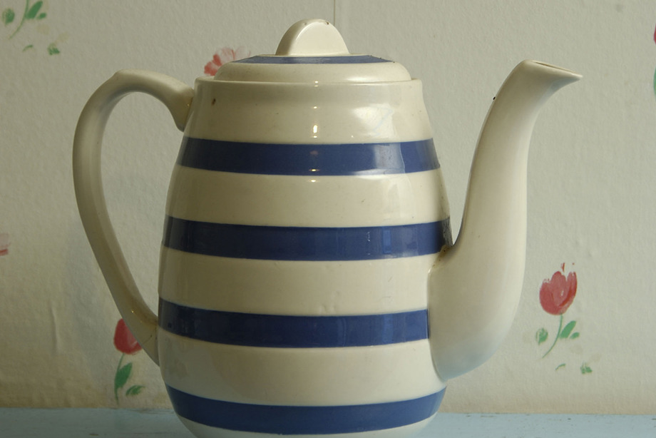 A blue and white striped teapot