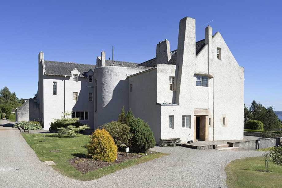 A large, white building with large paths leading to it