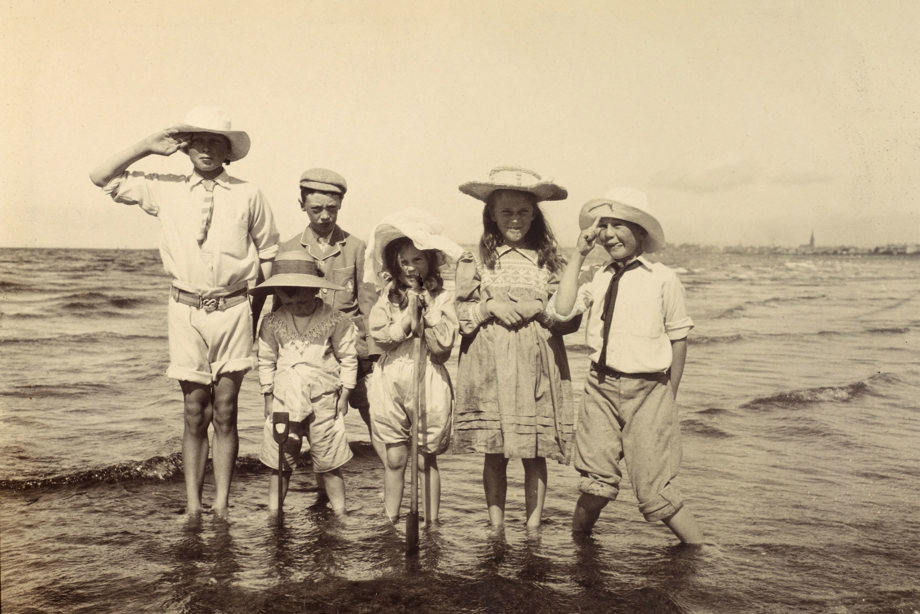 Photograph of six children on a beach, possibly outside Ayr. PHOTOGRAPH ALBUM NO 93 : THE STRANG COLLECTION, "SUNSHINE AND SHADE"