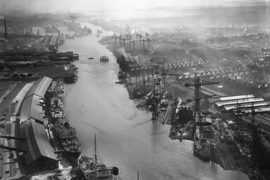 Oblique aerial view centred on Meadowside Quay and Fairfield's Shipbuilding Yard, taken from the W
