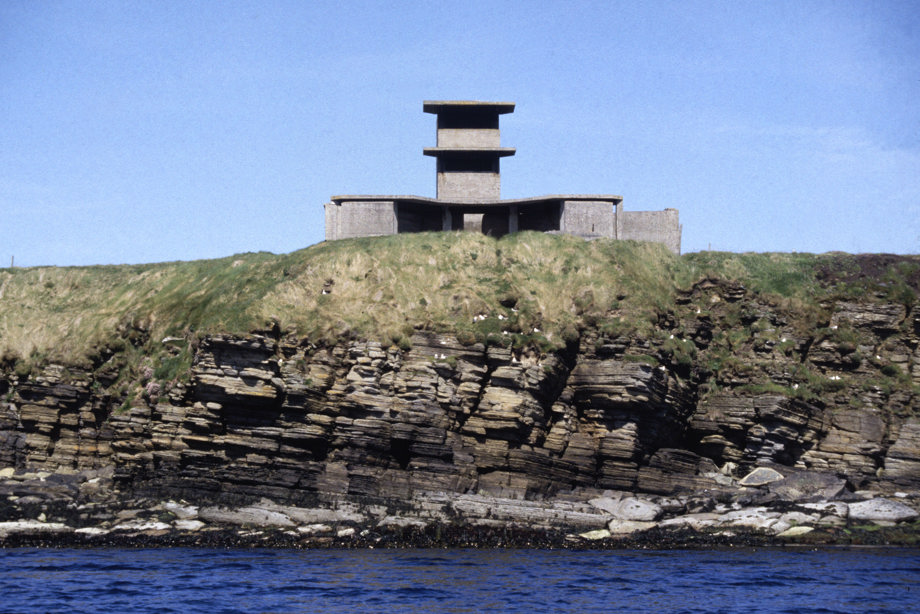 The Neb battery (ND39SW 41.8), Flotta, Orkney Islands, viewed from the sea. This twin 6-pounder gun emplacement with crew shelters and two storey observation forms part of the defences guarding the southern approaches to Scapa Flow