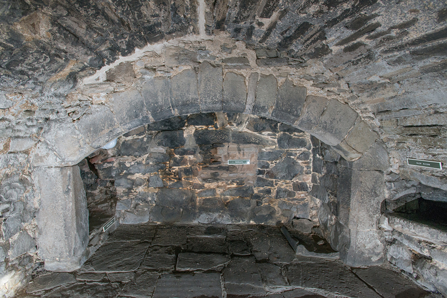 A large and well-used stone fireplace