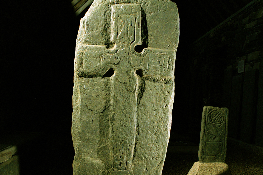 A carved stone decorated with a cross