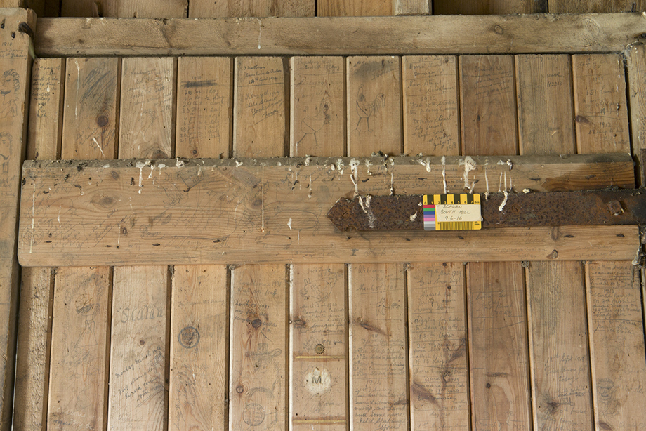 South mill. Ground floor. Detail of graffiti on south face of door.