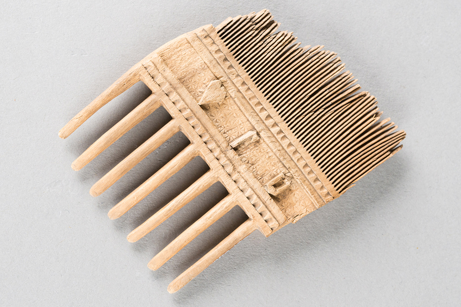 An engraved wooden comb
