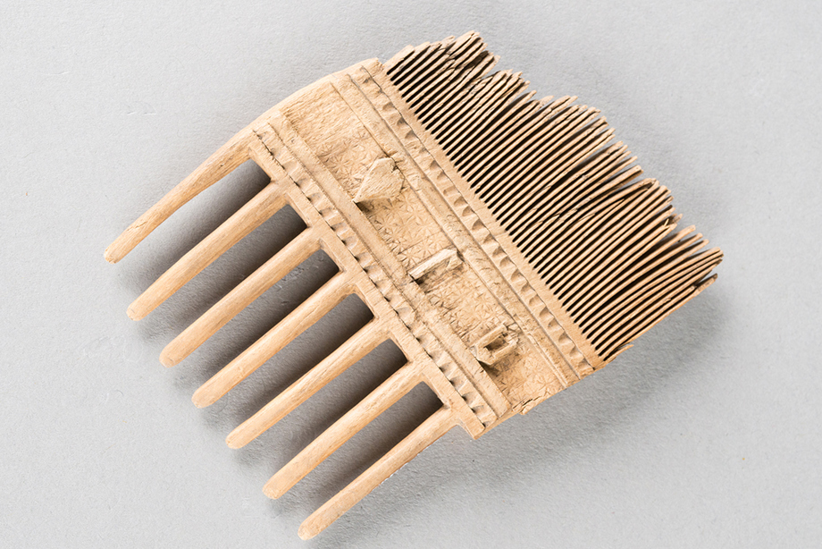 An engraved wooden comb