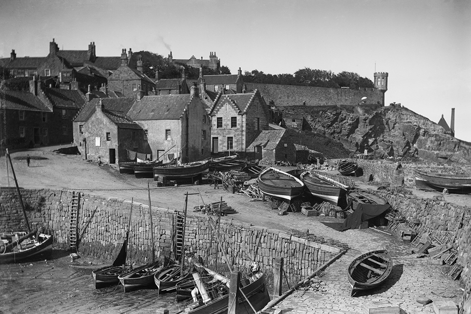 Little wooden boats in the harbour of a small town