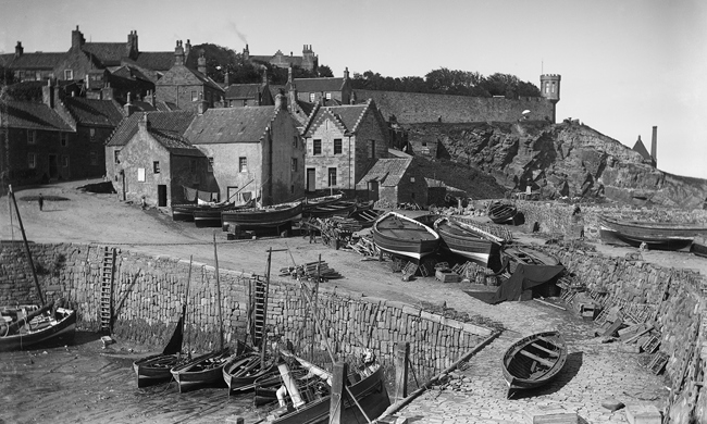 Little wooden boats in the harbour of a small town