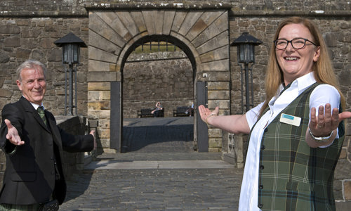 Two members of staff at Stirling Castle ready to welcome visitors