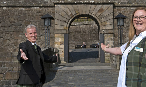 Two members of staff at Stirling Castle ready to welcome visitors