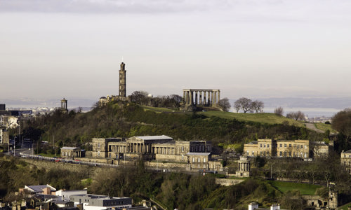 General view of Calton Hill, Dugald Stewart Monument, Nelson Monument, National Monument and the former Royal High School from Salisbury Crags, Holyrood Park