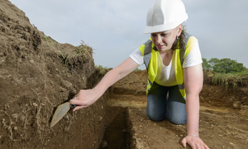 A woman in a hard hat and high vis vest at an Archaeological dig at Castle Douglas where finds, thought to possibly belong to a Viking hoard, were unearthed