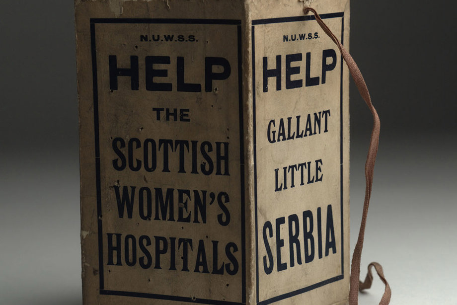 A cardboard box, with wording on the sides reading: "Help gallant little Serbia" and "Help the Scottish Women's Hospitals".