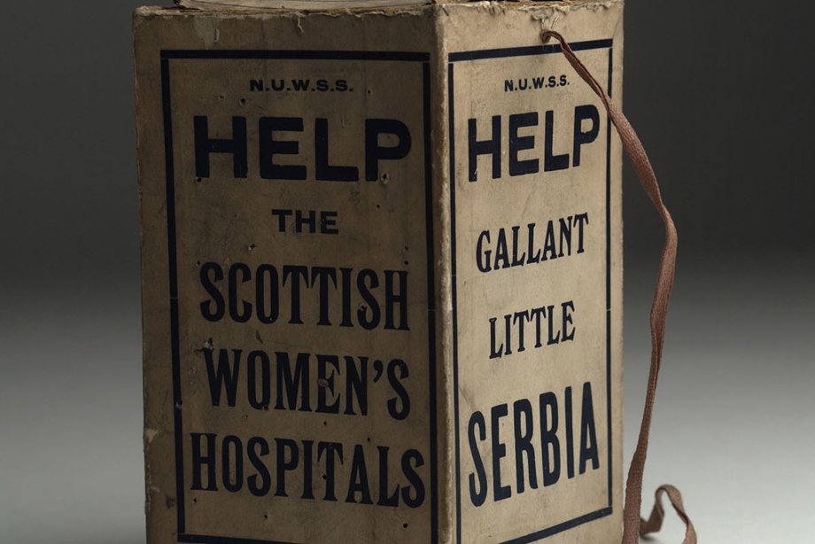 A cardboard box, with wording on the sides reading: "Help gallant little Serbia" and "Help the Scottish Women's Hospitals".