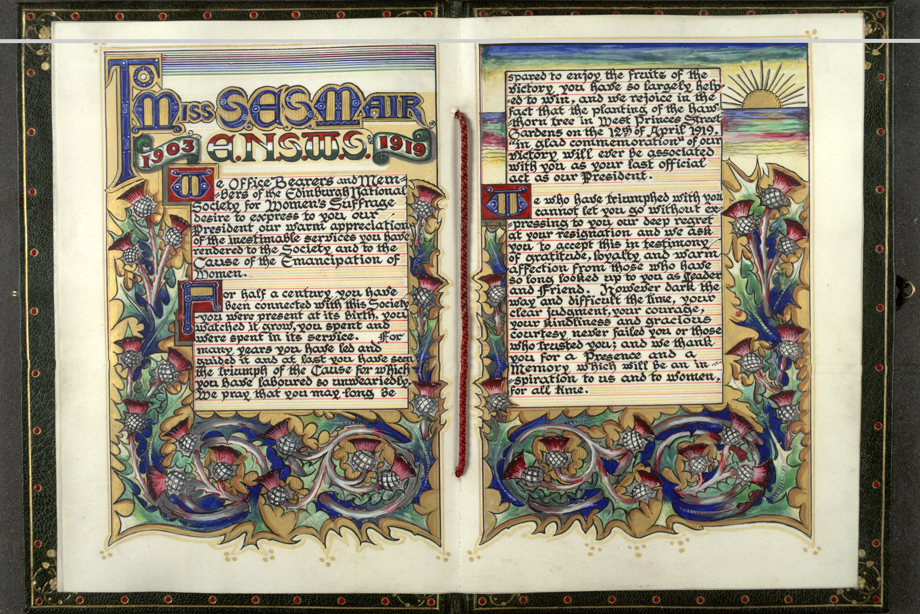 A book with colourful, decorated vellum pages