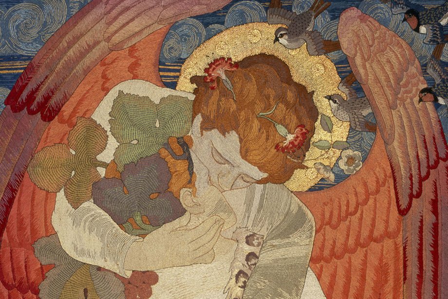 An embroidery of an angel kissing a woman who is wearing a leopard skin