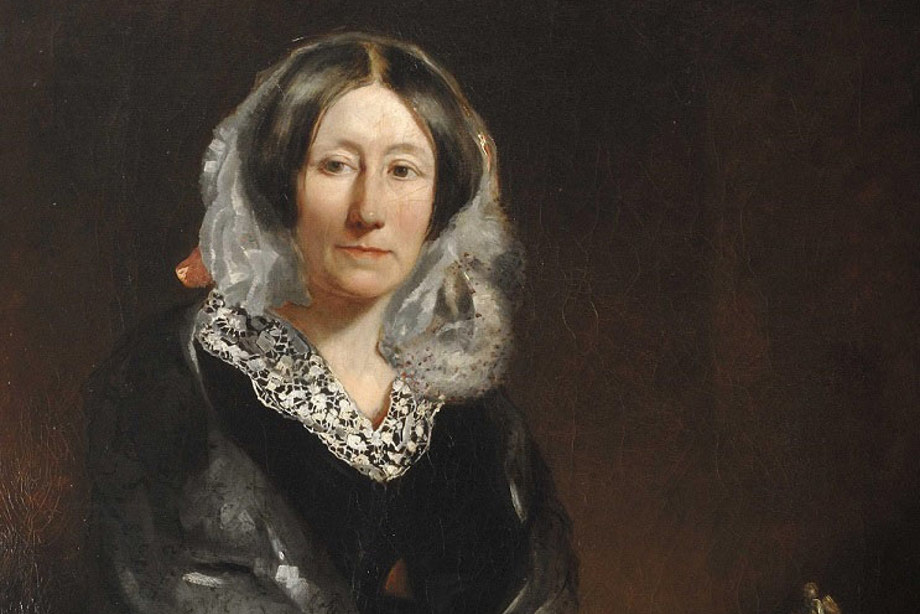 Mary Somerville holding a feather quill