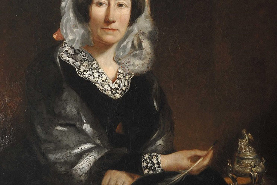 Mary Somerville holding a feather quill