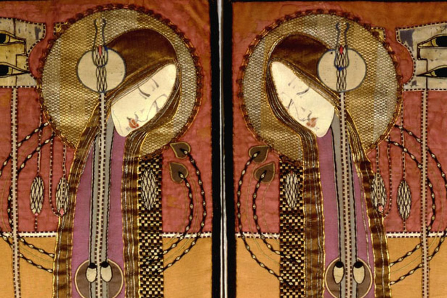 A colourful design of two elongated bodies made of silks and embroidery  