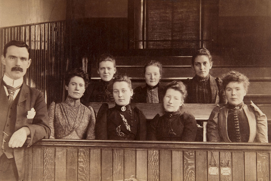 Marion Gilchrist sitting with a group of other women and one man.