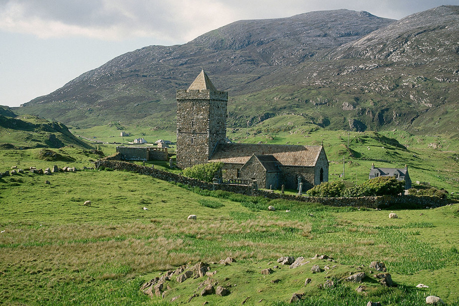 A church surrounded by green hills