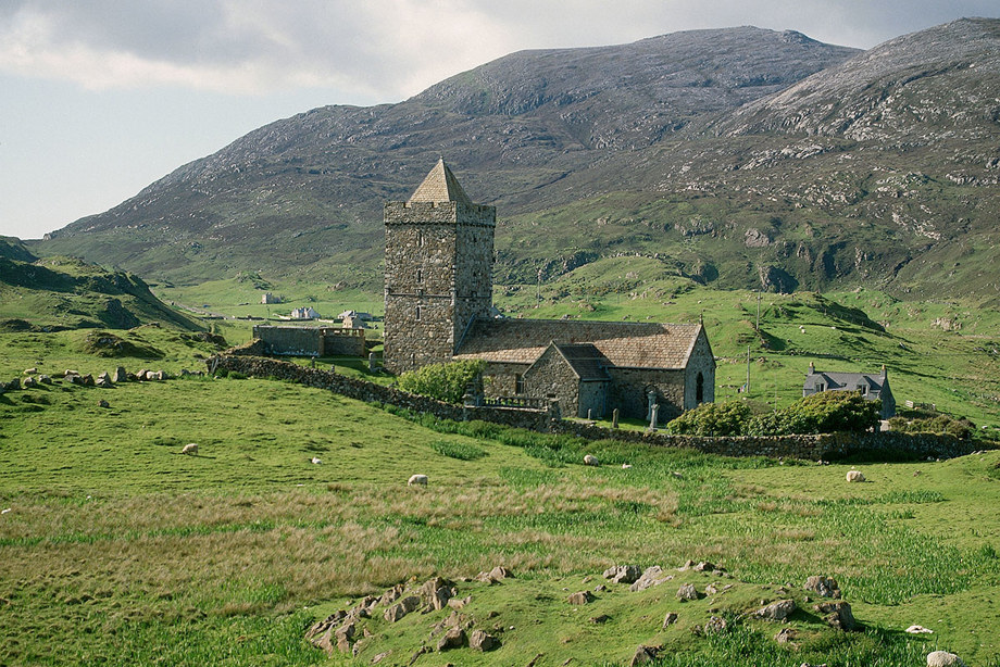 A church surrounded by green hills