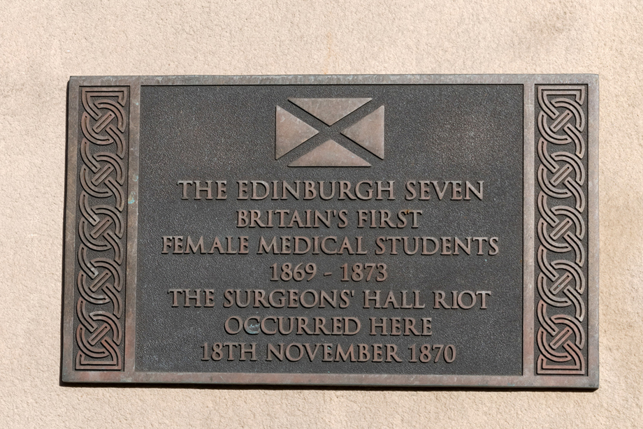 A plaque reading: The Edinburgh Seven, Britain's first female medical students. 1869 - 1873. The Surgeon's Hall Riot occurred here 18th November 1870