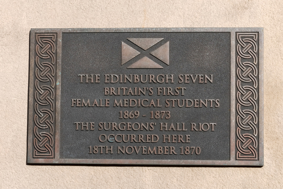 A plaque reading: The Edinburgh Seven, Britain's first female medical students. 1869 - 1873. The Surgeon's Hall Riot occurred here 18th November 1870