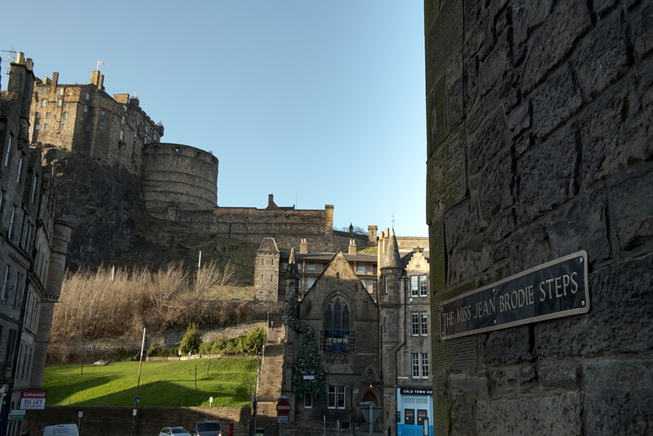 A sign reads "Miss Jean Brodie Steps" beside a view of Edinburgh Castle