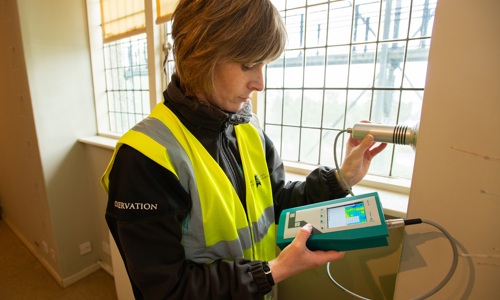 A person using scientific equipment inside a historic building