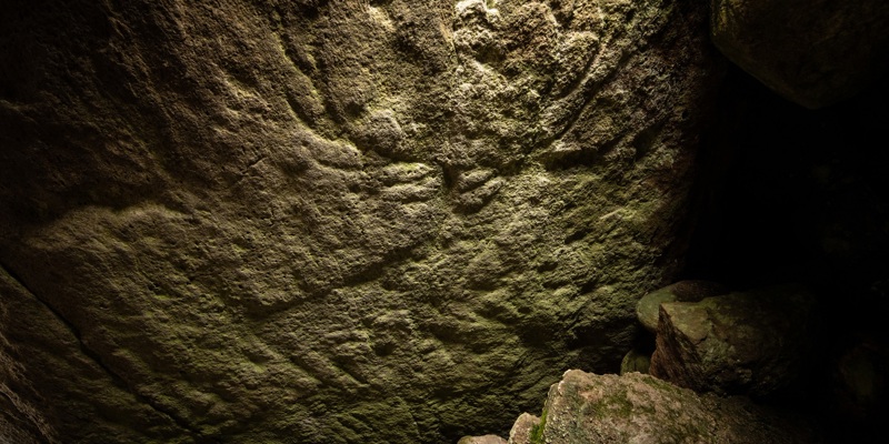 a stone surface carved with the outline of a stag, with giant antlers