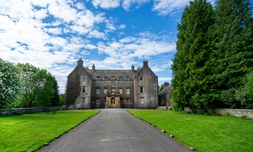 exterior of a grand, three-storey 17th century country house 