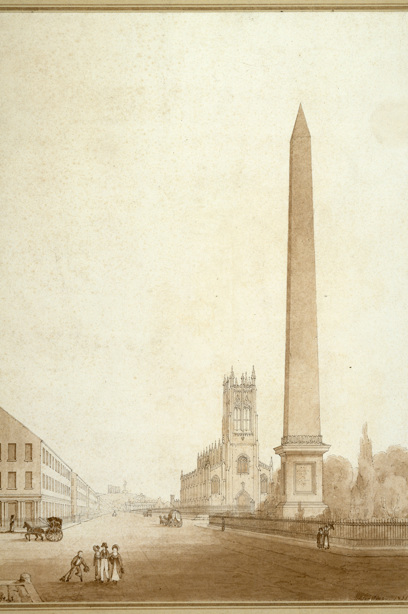 A tall obelisk beside a cobbled Princes Street in Edinburgh