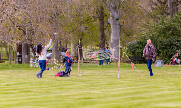 Family playing tennis in the grounds of Duff House
