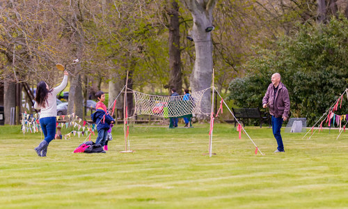 Family playing tennis in the grounds of Duff House
