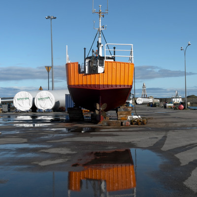 The columns for wind turbines at Wick Harbour awaiting transportation to and installation in the North Sea