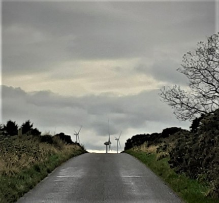 Wind turbines at work in the hills above Inverbervie