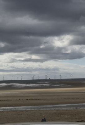 This image "Weather is changing" describes, how climate change has already affected Scotland, by the storm cloud in the middle of a supposedly sunny d