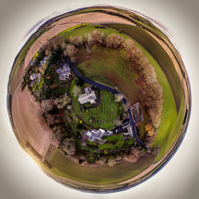 A so called "Tint Planet" drone image which features a circular view of the village of Fern.